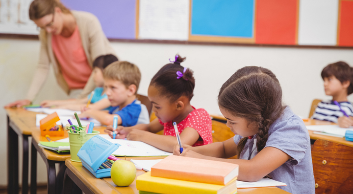 Pupils at desks with teacher