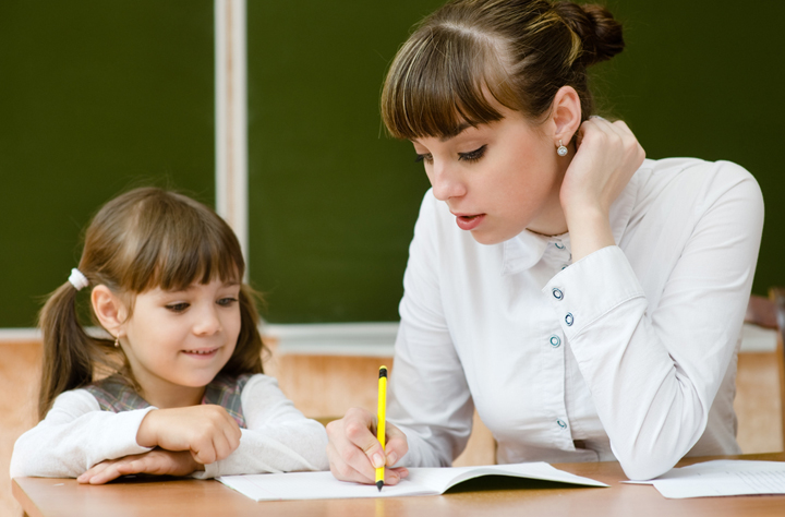 Teacher helping a student